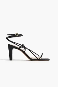 Los mejores zapatos de mujer que estilizan hoy 3 Strappy sandals with square toes, narrow, covered block heels, and a strap that winds around ankle and fastens with a round metal buckle.